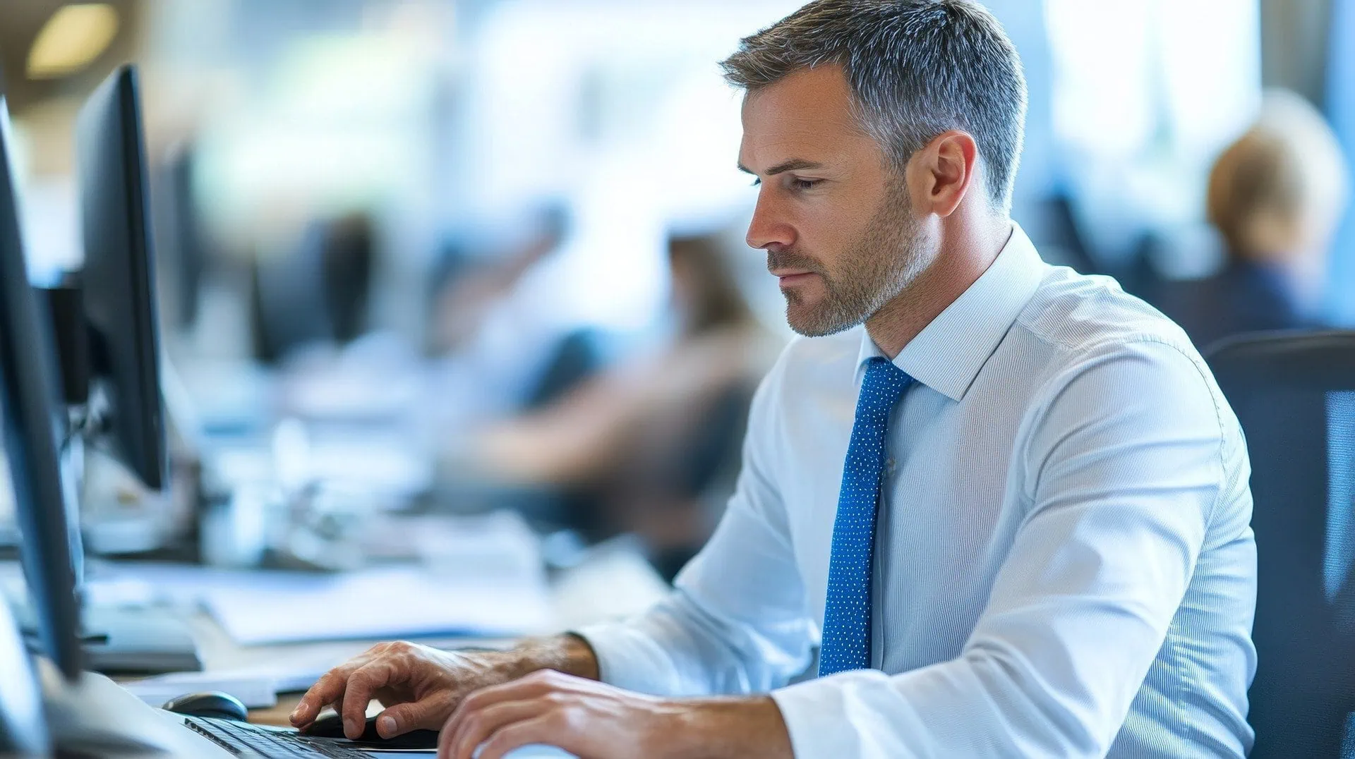 Business many typing in office environment