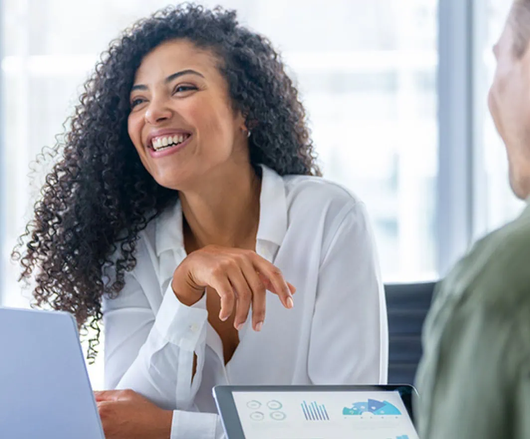 Woman smiling in office meeting